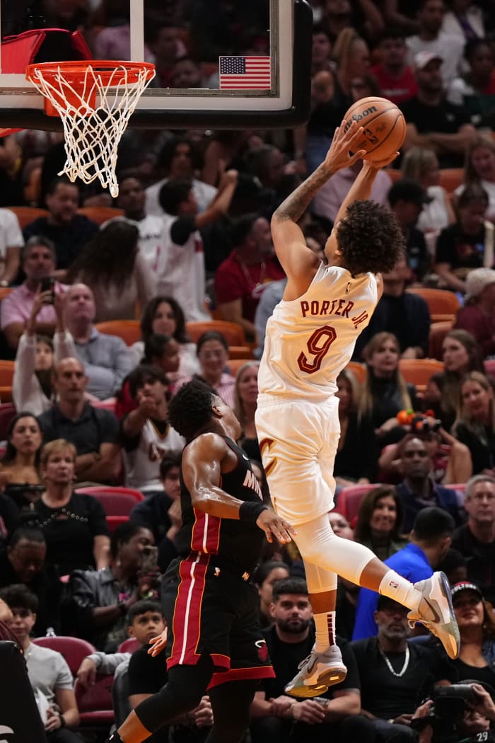Dec 8, 2023; Miami, Florida, USA; Cleveland Cavaliers guard Craig Porter (9) shoots over Miami Heat guard Kyle Lowry (7) during the first half at Kaseya Center.